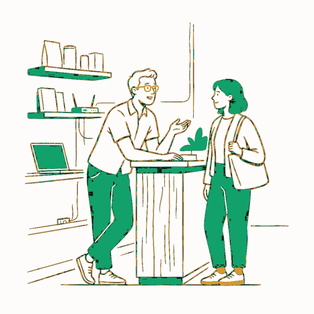 A shopkeeper and a customer talking easily at a counter while a laptop and network gear work quietly on the shelves behind them.