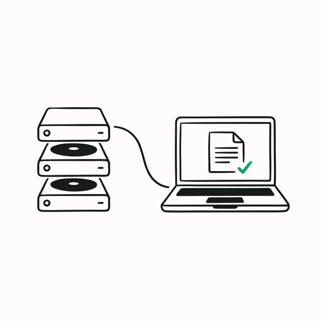 Stacked disk drives connected to a laptop where a document is reappearing on screen.